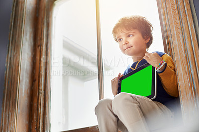 Buy stock photo Home, tablet and kid with green screen on internet, app or mockup space for learning by windowsill. Technology, chroma key and child with display for advertising, marketing or thinking of idea