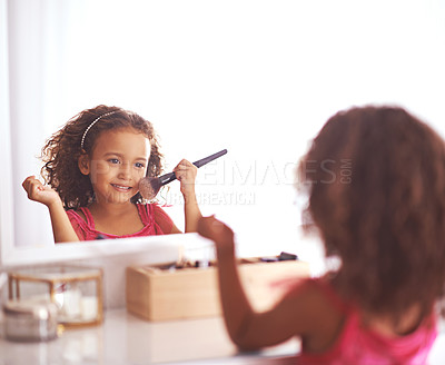 Buy stock photo Child, brush and mirror with makeup for skincare, beauty or happiness with cosmetics or smile. Girl, grooming and reflection of a young kid in with foundation, space or blusher in the home or house