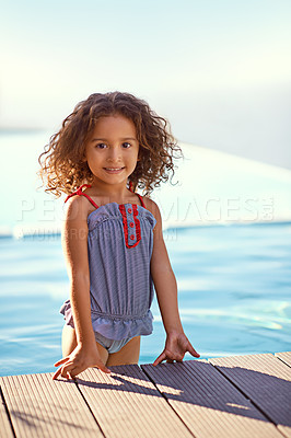 Buy stock photo Child, girl and water with portrait, swimsuit and blue summer sky for relax or smile. Kid, youth and sunshine with happiness, outdoor and play with curly hair and fun or sunny positivity or childhood