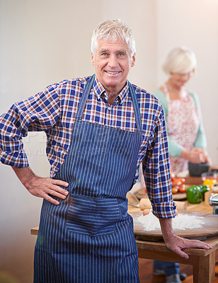 Buy stock photo Portrait of a senior man standing in front of the dinner table