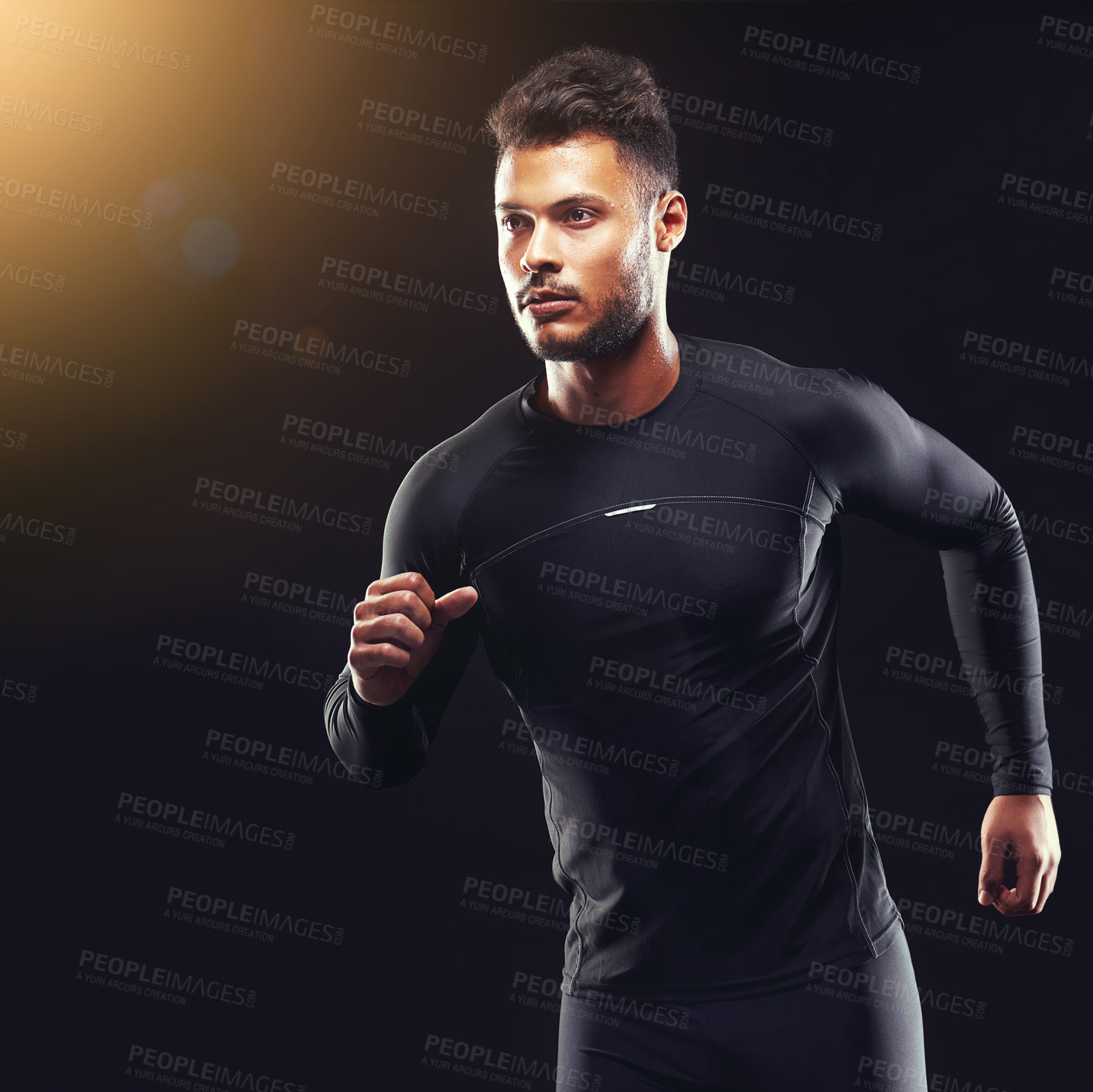 Buy stock photo Exercise, athlete and runner man in studio for sprint workout, marathon or competition with black background. Sport, lens flare and male model person for speed, endurance training and wellness