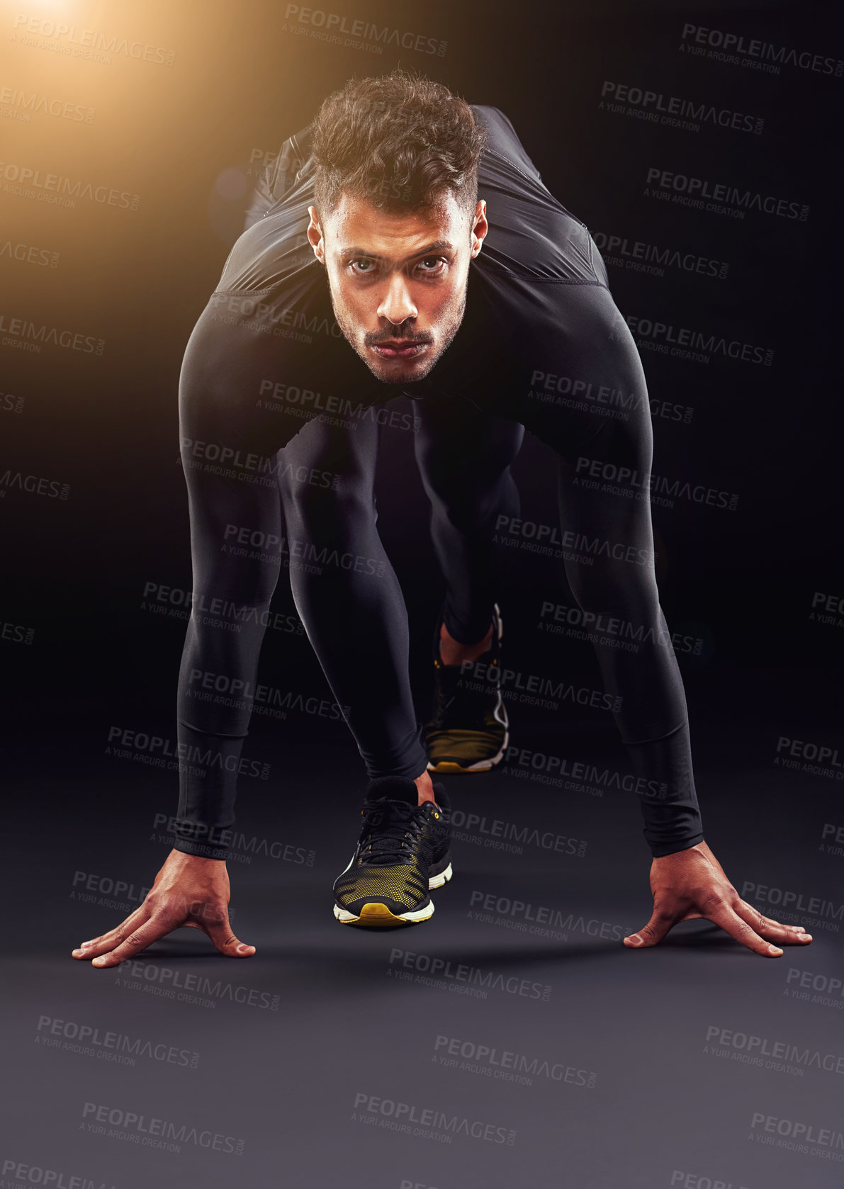 Buy stock photo Runner, portrait and man ready in studio with start, confidence or race challenge for health, wellness and power. Serious, running and athlete on black background for exercise, fitness or competition