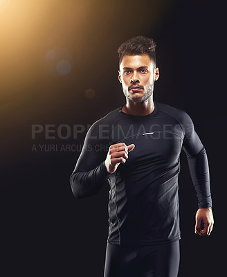 Buy stock photo Workout, athlete and runner man in studio for sprint exercise, marathon or competition with black background. Sport, lens flare and male model person for speed, endurance training and wellness