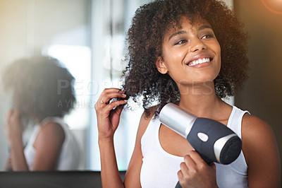 Buy stock photo Black woman, hairdryer and hair with beauty and texture, curly hairstyle or frizz with morning routine in bathroom. Natural, haircare and heat treatment for growth, shine and cosmetics at home