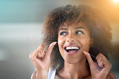 Buy stock photo African woman, dental floss and happy for cleaning for oral wellness, health or benefits for mouth in bathroom. Girl, person and teeth whitening with string, lens flare or change for results in house