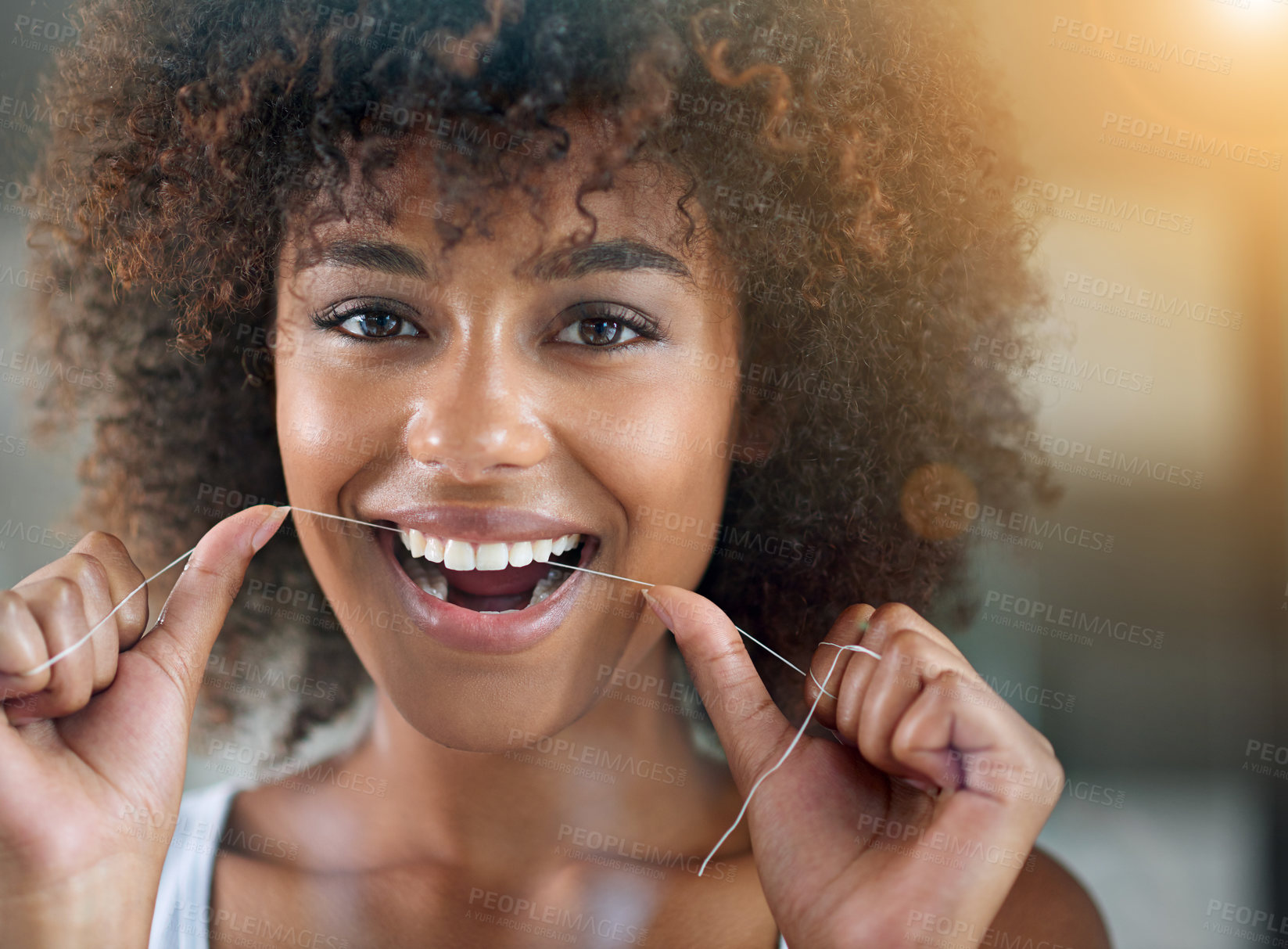 Buy stock photo Cropped portrait of a young woman flossing in the bathroom