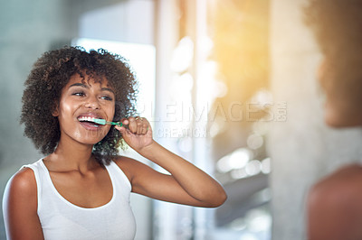 Buy stock photo Mirror, dental and black woman brushing teeth, fresh breath and oral health in the bathroom. Female person, happy model and lady with wellness, mirror and hygiene with morning routine and tooth care