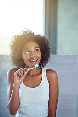 Buy stock photo African woman, toothbrush and happy in bathroom for oral wellness, health and benefits for mouth in home. Girl, person and teeth whitening with thinking, cleaning and toothpaste for results in house