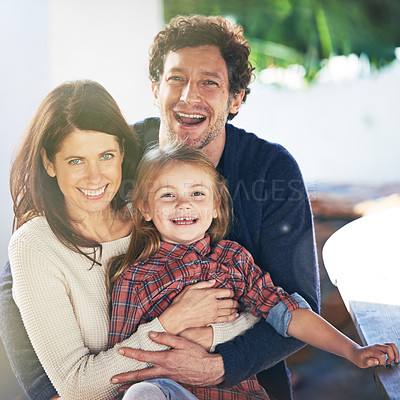Buy stock photo Happy family, portrait and smile in garden of home with embrace, relax and weekend break in summer. Parents, girl child and face with happiness in backyard of house with healthy relationship and love