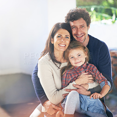 Buy stock photo Happy family hug in portrait, relax in backyard with mom and dad with kid with love and care outdoor. People embrace with smile, woman and man with girl child spending quality time together