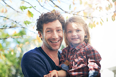 Buy stock photo Happy, portrait and father with daughter in backyard garden for hugging, bonding or affectionate. Happiness, relax and excited with man and young girl in outdoors for embrace, autumn and care