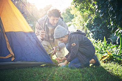 Buy stock photo Father, kid and preparing tent for camping outdoor in nature on vacation while bonding in summer sunset. Dad, boy and setting up camp, learning and getting campsite ready in forest for holiday travel