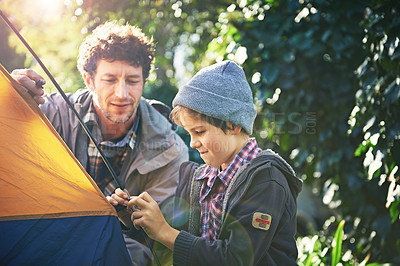 Buy stock photo Father, child and set up tent for camping outdoor in nature on vacation while bonding in summer. Dad, boy and preparing campsite, learning and getting ready in forest for travel, education or holiday