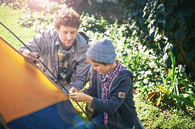 Buy stock photo Father, kid and set up tent for camping outdoor in nature on vacation while bonding in summer. Dad, boy and preparing campsite, learning and getting ready in forest for travel, education and holiday.