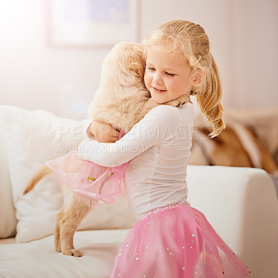 Buy stock photo Child, golden retriever or dog in a house to hug for love, care and development. Face of a cute girl kid and animal puppy or pet in a tutu playing together as friends on the lounge sofa for happiness