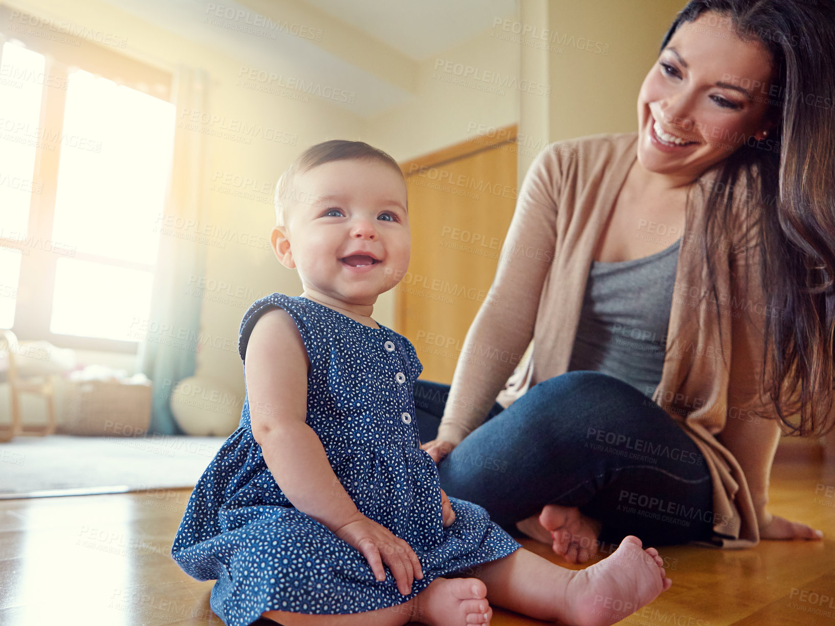 Buy stock photo Shot of a mother with her baby girl at home