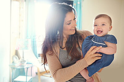 Buy stock photo Mother, bonding or laughing baby girl in house living room or family home bedroom in support trust, security or love carrying. Smile, infant or happy mom holding child in funny or comic tickling game