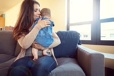 Buy stock photo Mom, bonding and baby girl hug in house living room or family home sofa in support trust, love and security. Smile, infant or happy mother holding child or kid in embrace to stop crying or help sleep