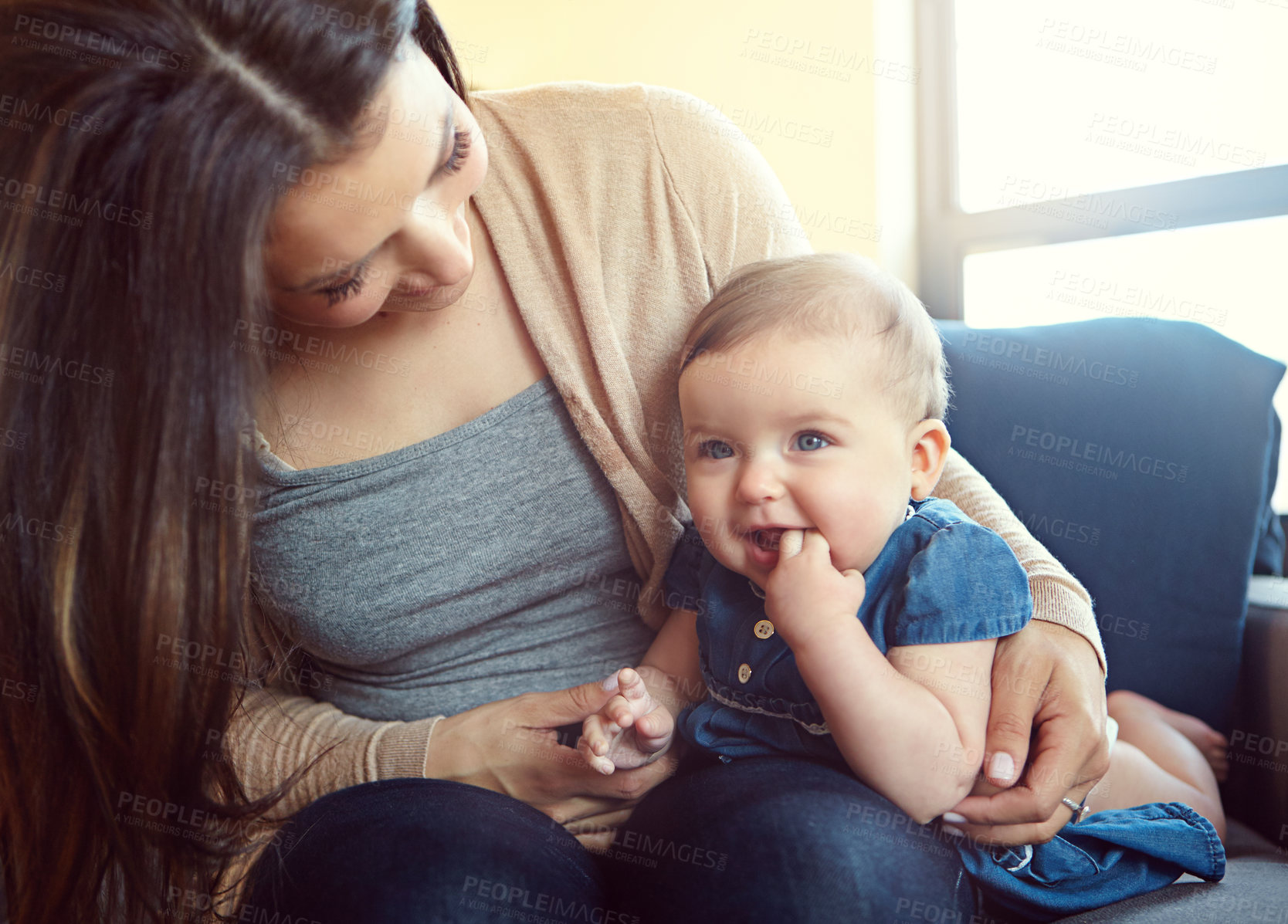 Buy stock photo Relax, happy and smile with mother and baby on sofa for bonding, quality time and child development. Growth, support and trust with mom and daughter in family home for health, connection and care