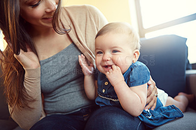 Buy stock photo Shot of a mother with her baby girl at home
