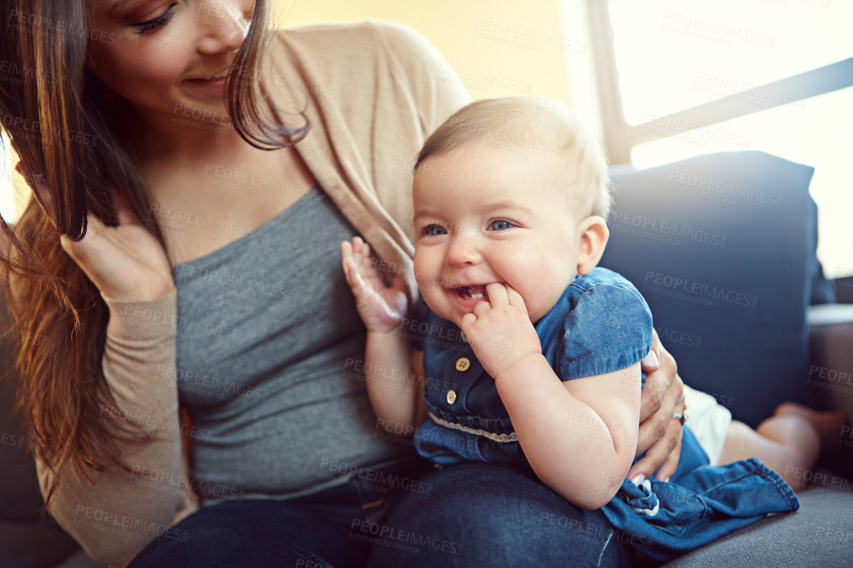 Buy stock photo Shot of a mother with her baby girl at home