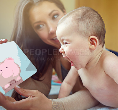 Buy stock photo Mother, baby and family for learning, development and pig picture book for fun education and growth. Woman and child in house to bond and play with love, security and care with a smile and happiness