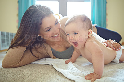 Buy stock photo Shot of a mother and her baby daughter at home