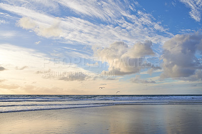 Buy stock photo Seascape and landscape of a golden sunset on the west coast of Jutland in Loekken, Denmark. Beautiful cloudscape on an empty beach at dusk. Clouds over the ocean and sea in the morning