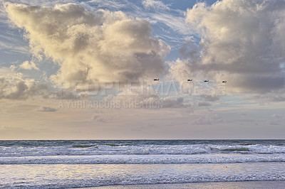 Buy stock photo Seascape and landscape of a blue sunset on the west coast of Jutland in Loekken, Denmark. Beautiful cloudscape on an empty beach at dusk. Clouds over the ocean and sea at night with copyspace