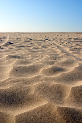 Buy stock photo Landscape of sand dunes on west coast of Jutland in Loekken, Denmark. Closeup of sand surface texture on empty desert with blue sky and copyspace. Peaceful calm scenic to explore for travel vacation