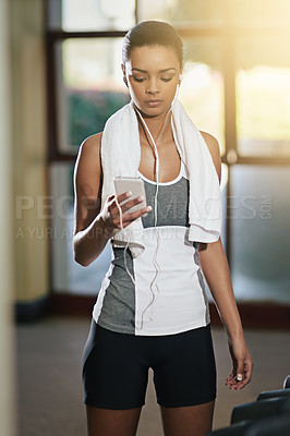 Buy stock photo Gym, woman and smartphone with earphones for music on exercise break, fitness and routine. Female person, workout and mobile phone for songs, album and playlist with training for health and wellbeing
