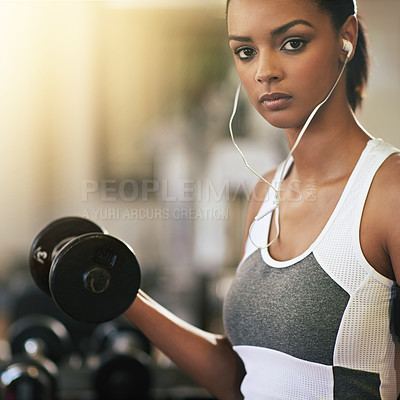Buy stock photo Portrait, music and dumbbell with a woman in the gym, streaming audio through earphones while training. Exercise, workout and weightlifting with a female bodybuilder in a sports club for fitness
