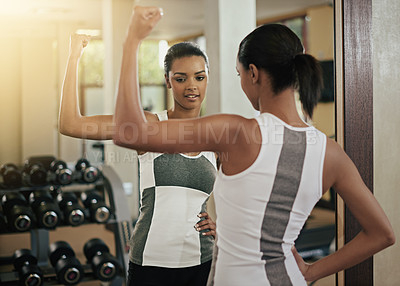 Buy stock photo Woman, strong and flex in mirror at gym with fitness, workout and exercise of bodybuilder with reflection. Progress, arm growth or proud girl athlete with sport training, wellness or bicep muscle