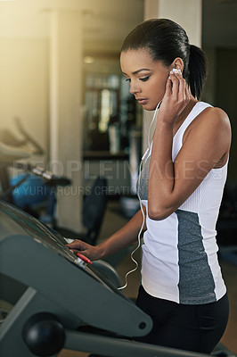 Buy stock photo Black woman, gym and music in treadmill for workout to exercise and fitness routine for health. Female person, earphone and training or  commitment for wellness, wellbeing and self care in sportswear
