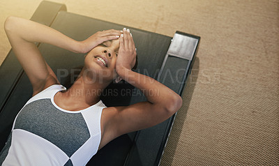 Buy stock photo Headache, stress and black woman lying on treadmill after workout, exercise and training routine for wellness. Tired, health and athlete with fatigue from gym, cardio and fitness at gymnasium