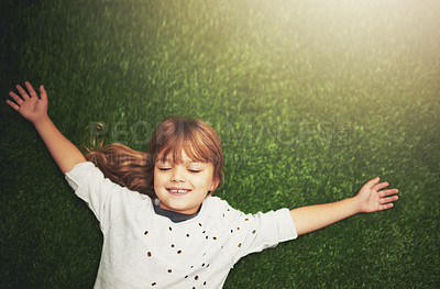 Buy stock photo Happy, top view and child on grass for relax, playful fun and happiness in garden. Family, nature and above of young girl for childhood, playing and freedom on weekend, vacation or holiday outdoors 