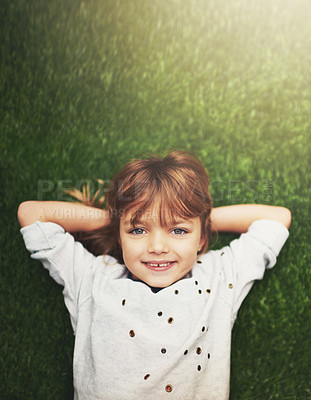 Buy stock photo Happy, top view and portrait of child on grass for relaxing, playful fun and happiness in garden. Family, nature and above of young girl for childhood, playing and freedom on weekend outdoors 