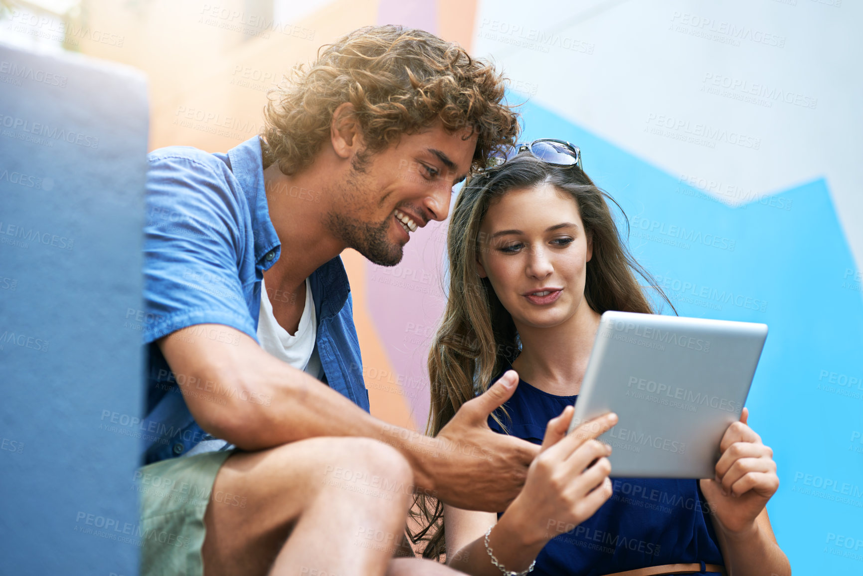 Buy stock photo Tablet, education and couple of friends on university or college campus together for learning or study. Technology, smile or scholarship with happy young man and woman students on academy stairs