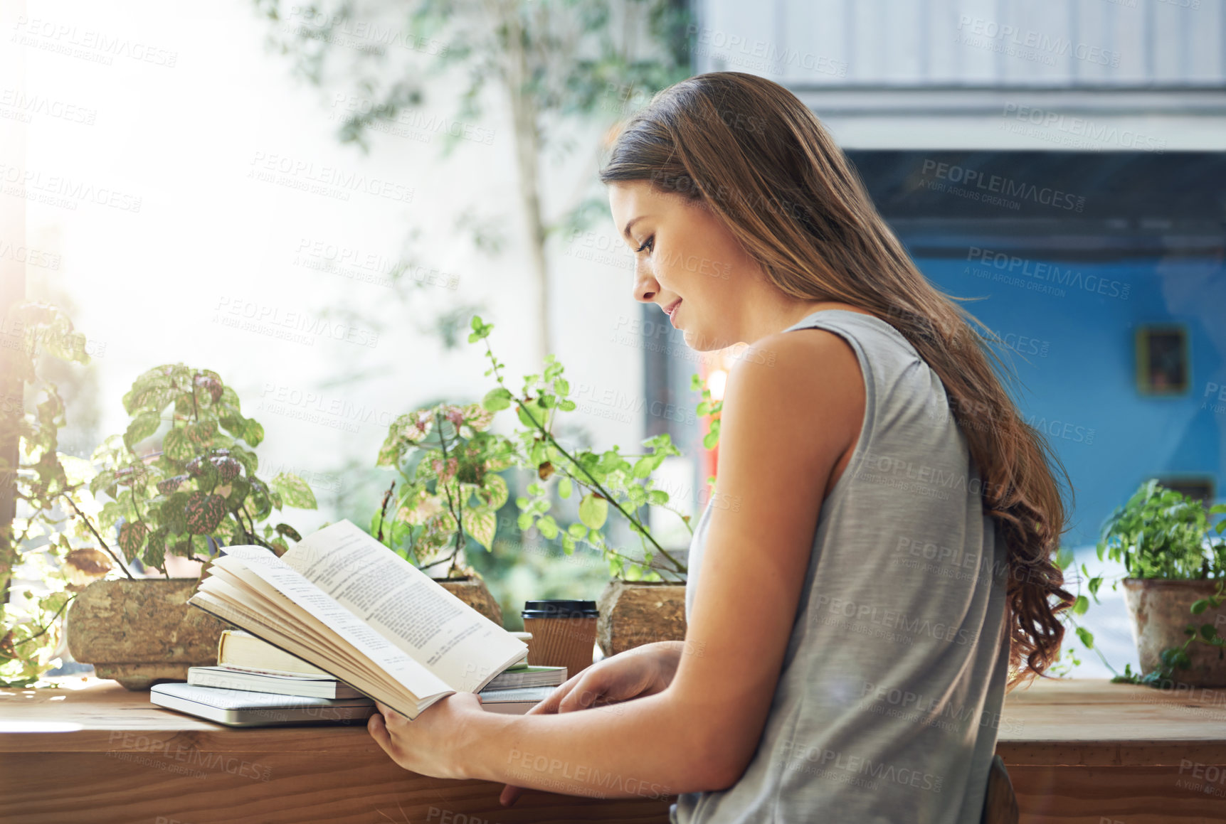 Buy stock photo Book, coffee shop and relax with woman reading at table as customer for break, caffeine or literature. Cafe, flare or knowledge and young person at window in restaurant with novel or story on weekend