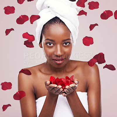 Buy stock photo Portrait, dermatology and black woman with red petals, beauty and treatment on a white studio background. Face, African person and model with natural cosmetics and grooming with skincare and luxury