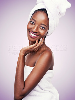 Buy stock photo Studio shot of a beautiful young woman wearing a towel on her head