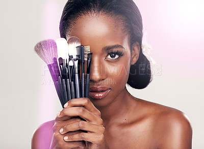 Buy stock photo Cosmetics, makeup and portrait of black woman with brushes in studio with cosmetic application tools. Skincare, flare and skin care, face of beauty model with luxury contour brush on white background