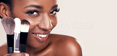 Buy stock photo Cosmetics, makeup brushes and portrait of black woman in mockup space on studio with cosmetic application tools. Skincare, blush and beauty banner, luxury facial skin care model on white background.