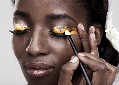 Buy stock photo Brush, makeup and face of black woman in studio for wellness, beauty and aesthetic. Cosmetology, skincare and person with tools for makeover application, eyeshadow and products on a white background