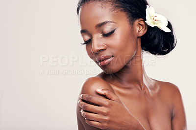 Buy stock photo Woman, face and flower for beauty in studio with skincare, natural glow and self care with confidence. Model, african person or pride for cosmetology, facial treatment and mockup on white background