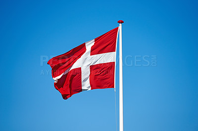 Buy stock photo Flag, blue sky and denmark with symbol of scandinavian country or danish state with red and white cross. Wind, pole and colorful representation of Dannebrog, history or nation in Copenhagen or Europe