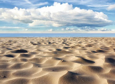 Buy stock photo Natural, sand ripples and beach with vacation, clouds and travel with tourism, adventure and texture. Empty, landscape and seaside with summer, holiday and outdoor with blue sky and environment