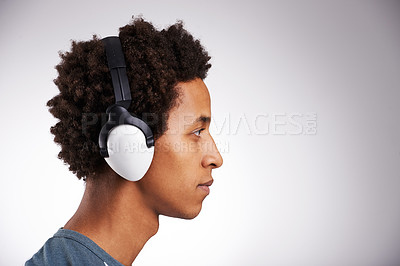 Buy stock photo Headphones, studio and profile of african man for music streaming, audio podcast or listening to radio with gray background. Mockup, aesthetic and person by headset for peace, relax or entertainment