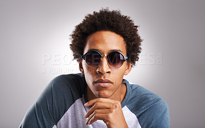 Buy stock photo Face, eyewear and fashion for man in studio, hand and pose isolated on white background. Sunglasses, stylish or fashionable with trendy accessory for black male model, afro and casual clothing