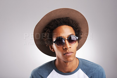 Buy stock photo Portrait, man and fashion with funky sunglasses in studio for designer casual hat style for creative eyewear. Hipster, male person and confident in natural clothes on isolated white background